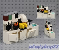 there is a small lego kitchen with many items in it