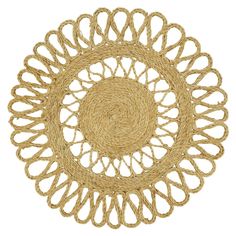 a round woven placemat made out of straw with an intricate design on the center