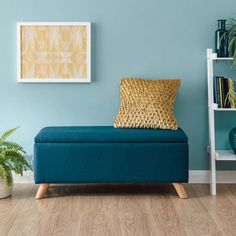 a living room with blue walls and wooden floors