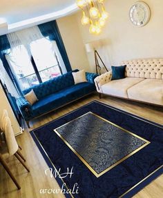 a living room filled with furniture and a blue rug