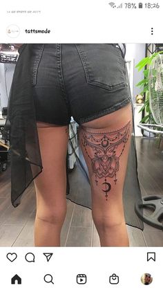 the back of a woman's thigh with tattoos on it