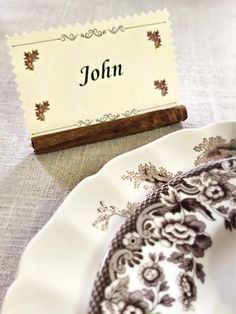 a place card is placed on a plate