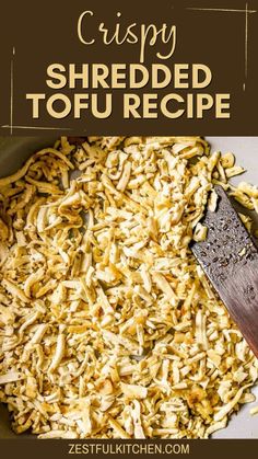 a pan filled with shredded tofu next to a knife