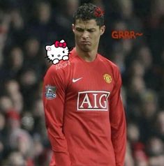 the soccer player is wearing a red uniform with hello kitty on it's head