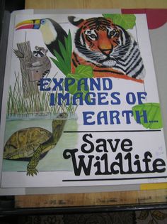 a sign with an image of a tiger and a turtle on it that says, expand images of earth save wildlife