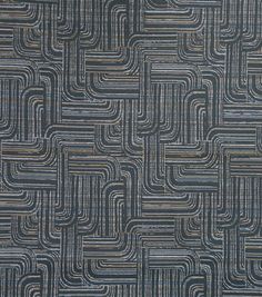 a blue and brown area rug with an abstract design