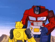 an animated image of a giant robot next to a smaller robot in front of a mountain