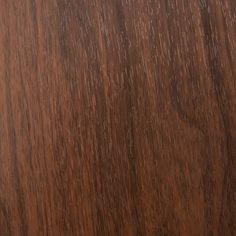 a close up view of the wood grains on this wooden flooring material, which is very dark brown