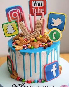 a birthday cake decorated with social media icons