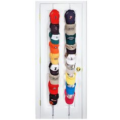 two hats hanging on the wall in a display case with multiple colors and styles of caps