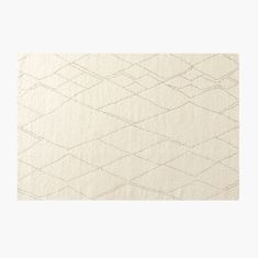 a white rug with an abstract design on it