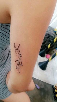 a small tattoo on the leg of a woman