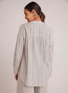 The oversized button-down shirt design makes it perfect for summer, ideal for casual gatherings or as a beach cover-up. Comfortable fit and soft fabric. 52% Cotton 42% Viscose 6% Linen. SIZE CHEST SHOULDER TO HEM XS 38" 27" S 40" 27 1/2" M 42" 28" L 44" 28 1/2" Beach Button-up Linen Top, Linen Button-up Top For Beach, Beach Linen Button-up Top, Relaxed Fit Button-up Blouse For Vacation, Vacation Relaxed Fit Button-up Blouse, Vacation Button-up Blouse In Relaxed Fit, Vacation Button-up Blouse Relaxed Fit, Chic Oversized Shirt For Vacation, Striped Button-up Beach Shirt