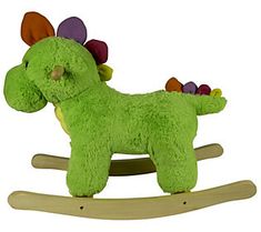 a green stuffed animal rocking toy with flowers on its head