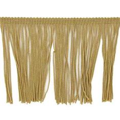 three gold fringes hanging on a white wall