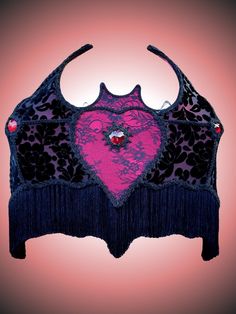 a pink and black top with a heart on it