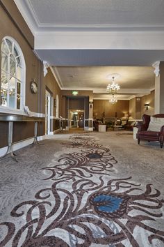 the lobby is clean and ready for guests to come into their hotel or reception room