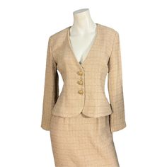 "Vintage tan with gold threading women's suit, tag says Victor Costa, sz 4, 100% polyester. Jacket is fully lined, buttons on the inside, has built in shoulder pads, gold decorative buttons with rhinestones down the front and on the sleeves. Jacket is fitted at the waist. Skirt is fitted, fully lined, clasp and zips up the back, has elastic at the waist on the back. Suit is in great condition, measurements are jacket shoulder to shoulder 16\" bust up to 34\" waist up to 26\" length 21\" sleeve l Elegant Suits With Gold Buttons, Fitted Beige Suit For Fall, Fitted Beige Suits For Fall, Elegant Fitted Blazer With Gold Buttons, Gold Notch Lapel Suits For Workwear, Formal Fitted Gold Sets, Gold Fitted Formal Sets, Fitted Beige Suits With Button Closure, Gold Long Sleeve Suits For Work