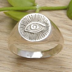 Crafted from sterling silver in the thriving lands of Bali, Komang Suastra's newest signet ring comes in a combination finish that enhances its mystic aura. Equipped with a sturdy band, the front features the Eye of Providence, an icon associated with divinity. The Eye Of Providence, Signet Ring Silver, Mystic Eye, Eye Of Providence, Eye Symbol, Silver Signet Ring, Signet Ring, Ring Silver, Wizard