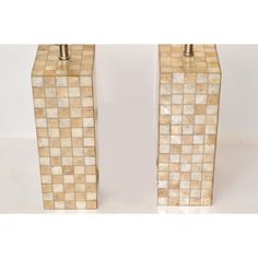 two vases made out of ceramic tiles