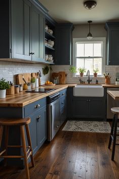 a kitchen with wooden floors and blue cabinets