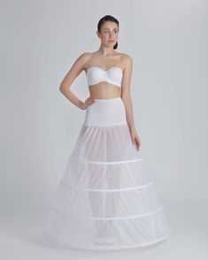 Lightweight crinoline and hoops petticoat with tailed layers for an aline wedding dress. Made with bones. The petticoat comes in ivory color. Waistline closing - Elastic Band Skirt diameter at the bottom: 320 cm The petticoat structure: J-155C Pettıcoat, 4 Hoops, 320 cm This petticoat is made with bones only (no layer of crinoline) and it's recommended only for dresses with heavy skirts. Our model designed for A line model wedding dresses provides the look you want. Brand new, high quality crino Skirt For Wedding Dress, Crinoline Wedding Dress, Skirt For Wedding, Hoop Petticoat, Medieval Revival, Frozen Costumes, Model Wedding, Crinoline Dress, Gown Costume