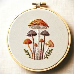 an embroidery project with mushrooms on it