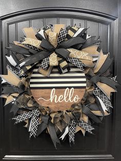 a black and white wreath with the word hello on it