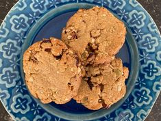 three cookies on a blue and white plate