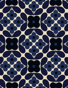 a blue and black flower pattern on a white background with dark circles in the center