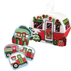 an ornament shaped like a train with christmas decorations on the front and sides