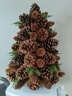 a christmas tree made out of pine cones