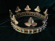 New for 2022! This design was made at the request of a client for an English ducal coronet. I took inspiration from various ducal coronets and heraldic drawings to produced this one. I am offering 2 sizes, a 24 inch circumference with 8 leaves, and a 21 inch circumference with 7 leaves. Padding maybe added inside to reduce the size. The cornet is made of metal alloy embellished with rhinestones and faux pearls. I have a few cabochons if you would like an earlier time period look. Please message Celtic Crown, Flower Stationary, King And Queen Crowns, Strawberry Leaves, Wedding Hairband, Mermaid Aesthetic, Queen Crown, Time Period, Tiaras And Crowns