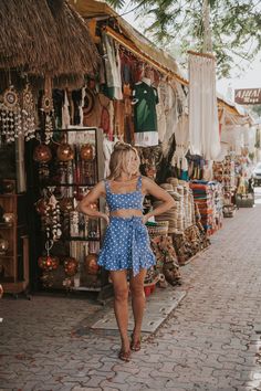 a woman standing in front of a store