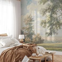 a bed room with a neatly made bed and a painting on the wall