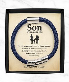 a red leather bracelet with the words to our son on it