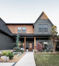 a house that has a walkway leading up to the front door and side yard area