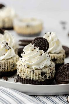 oreo cookies and cream cupcakes on a white plate with chocolate cookie slices