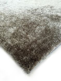 an area rug is shown in grey and white colors on a white background with soft shadow