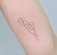 four leaf clover tattoo on the arm