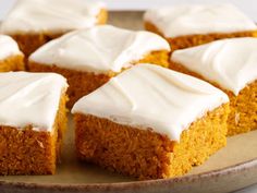 several pieces of cake on a plate with frosting