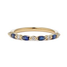 a yellow gold ring with blue sapphire and diamonds