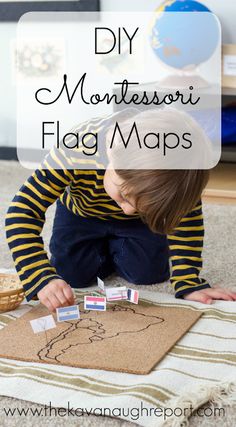 a young boy playing with montessoi flag maps on the floor in front of a book