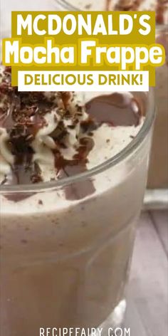 a close up of a drink in a glass with whipped cream and chocolate toppings