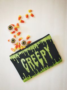 This oozing slime pouch is a perfect accessory for every creepy goon this haunting season. These pouches are perfect for a weekend trip or to carry any of your little odds and ends on the daily. Accessory bag is 100% polyester outer with laminate inner lining. Black zipper enclosure and gold zipper puller. Available in two sizes. ◆ S: 8.35 in. x 5.99 in. ◆ L: 11.82 in. x 8.35 in. Original design created for ShadowCult, printed and shipped in the US. ☟CANCELLATIONS & REFUNDS☟ I partner with a print provider who handles the printing and shipping for me. Once an order is placed, there's a chance I won't be able to alter or cancel it with the print provider. PLEASE confirm your shipping and SIZE information is correct before submitting an order. Each item is printed to order and therefore cann October Vibes, Horror Aesthetic, Pouch Makeup, Weekend Trip, Purse Pouch, Gold Zipper, Coin Purses, Spooky Halloween, Drink Sleeves