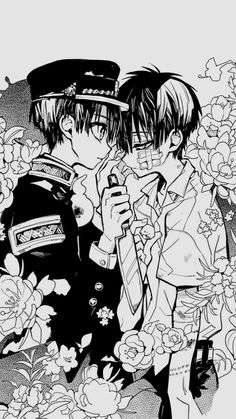 black and white drawing of two people kissing in front of flowers