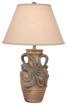 an octopus lamp with a beige shade on it's base and a light brown lampshade