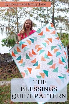 a girl holding up a quilt with the words, the blessing quilt pattern on it