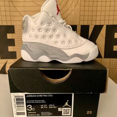 White And Gray Air Jordans 13s Toddler 3c Brand New In Box Baby Jordan Shoes Cool, All Jordans Baby, Jordan Shoes Retro Baby, Cute Air Jordans Baby, Air Jordans Retro 11 Grey, Best Jordans Baby, Luxury White Jordan Shoes With Boost Midsole, Luxury White Synthetic Jordan Shoes, Luxury White Lace-up Air Jordan 4