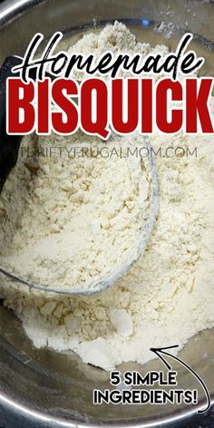 the ingredients for homemade bisquick are in a metal bowl with a measuring spoon